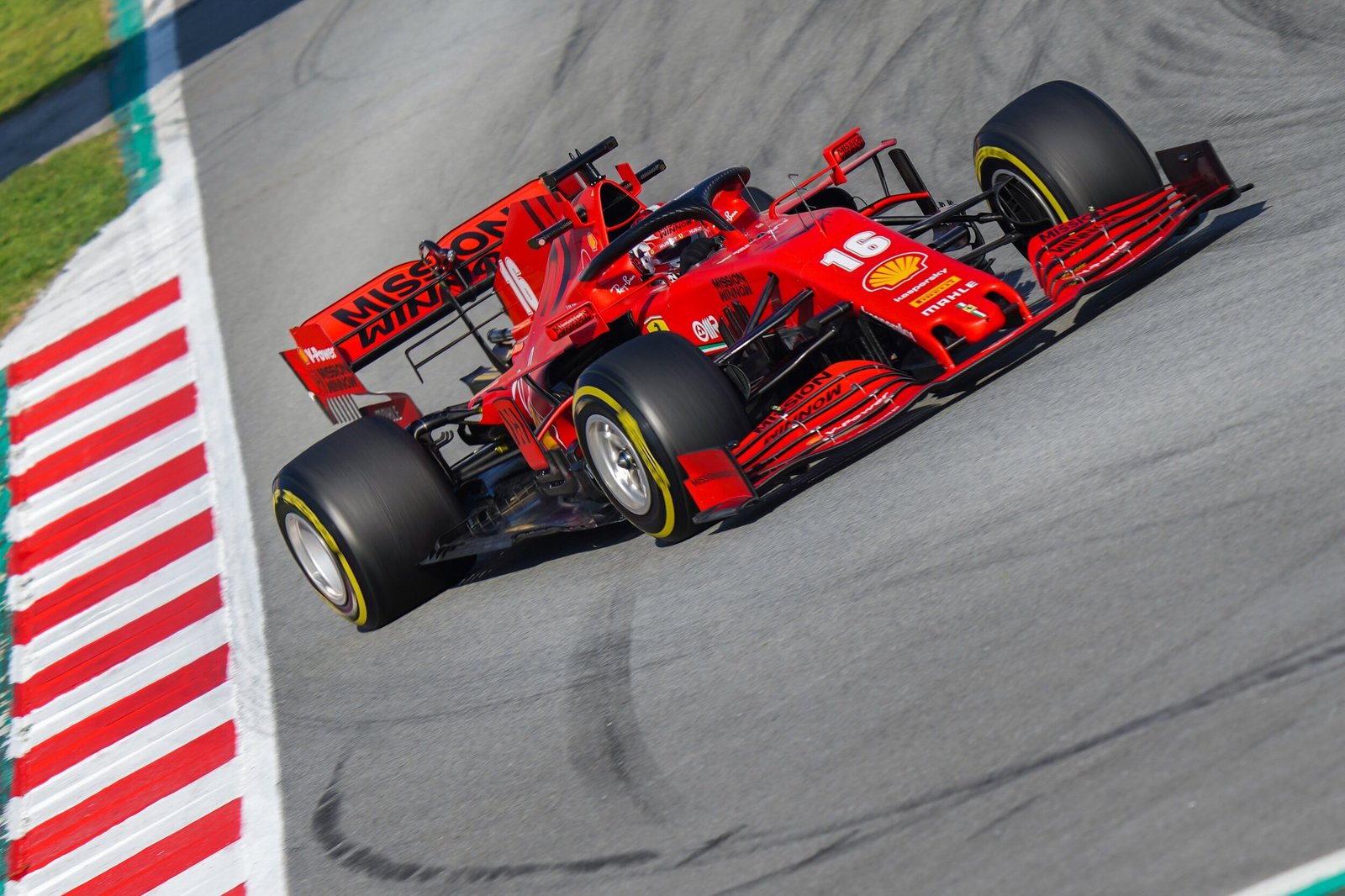Ferrari SF1000 number 16 running wide over the red and white kerb, Formula 1 pre-season testing, Circuit de Barcelona-Catalunya 2020